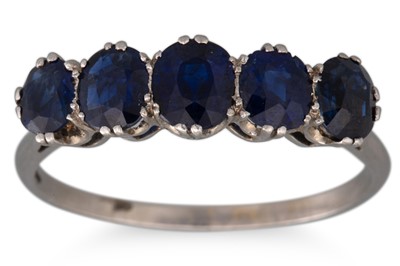 Lot 322 - A SAPPHIRE FIVE STONE RING, mounted in...