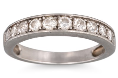 Lot 39 - A DIAMOND HALF ETERNITY RING, channel set,...