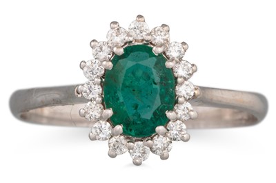 Lot 118 - AN EMERALD AND DIAMOND RING, the oval emerald...