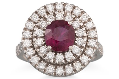 Lot 119 - A RUBY AND DIAMOND RING, the round ruby to...