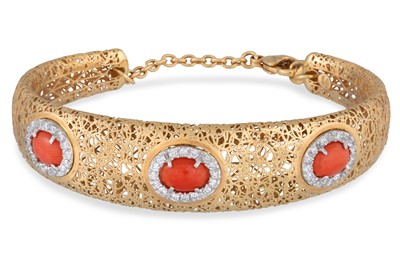 Lot 191 - A MEDITERRANEAN CORAL AND DIAMOND SET BANGLE,...