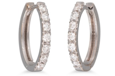 Lot 193 - A PAIR OF DIAMOND HOOP EARRINGS, 'huggie'...