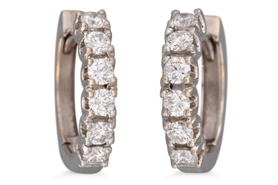 Lot 194 - A PAIR OF DIAMOND HOOP EARRINGS, 'huggie'...