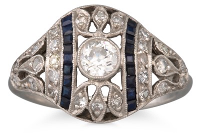 Lot 201 - A DIAMOND AND SAPPHIRE BOMBÉ RING, the central...