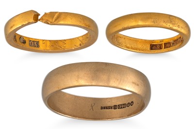 Lot 303 - TWO 23 CT YELLOW GOLD BANDS, 7.49 g. plus a...