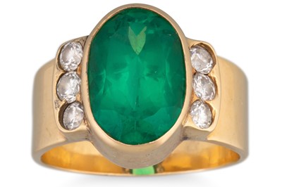 Lot 235 - AN EMERALD AND DIAMOND RING, the oval emerald...