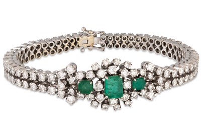 Lot 239 - A DIAMOND AND EMERALD BRACELET, the central...