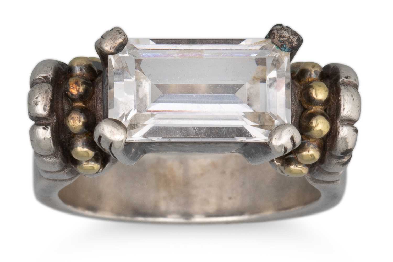 Lot 69 - A TOPAZ SET SILVER RING, with 18ct gold...