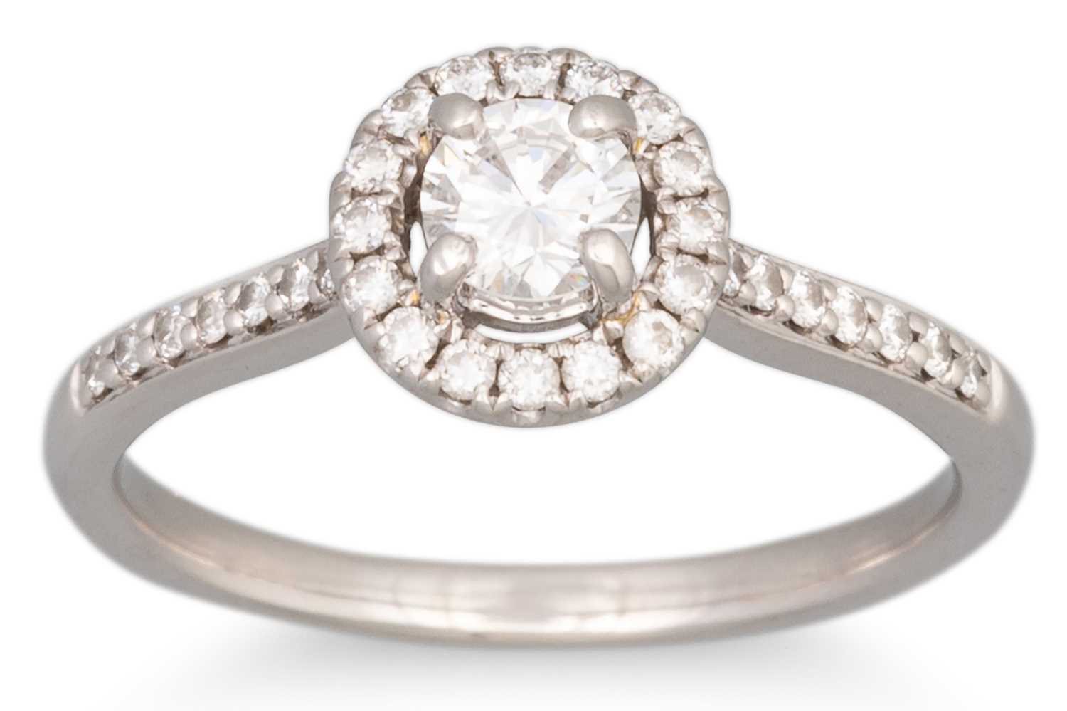 Lot 63 - A DIAMOND SET HALO CLUSTER RING, the centre...