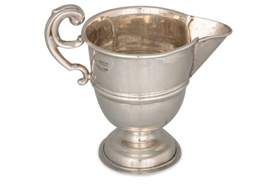 Lot 421 - AN IRISH SILVER HELMET SHAPE MILK JUG by H. S....