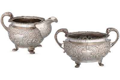 Lot 484 - A GEORGE III IRISH SILVER MILK JUG, together...