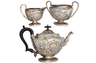 Lot 476 - A SILVER THREE PIECE VICTORIAN TEA SET, chased...