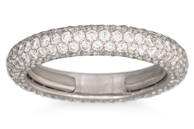 Lot 228 - A DIAMOND PAVE SET ETERNITY RING, mounted in...