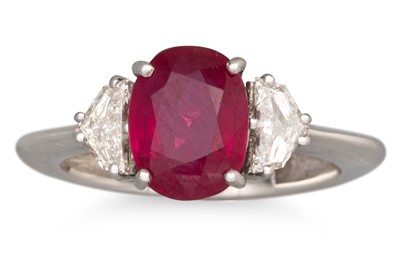 Lot 261 - A RUBY AND DIAMOND RING, the oval ruby to...