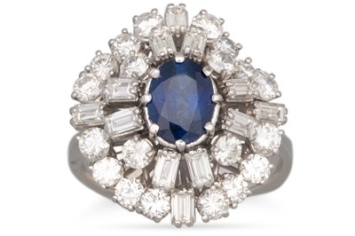 Lot 193 - A SAPPHIRE AND DIAMOND CLUSTER RING, the oval...