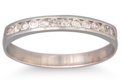 Lot 194 - A DIAMOND HALF ETERNITY RING, the channel set...