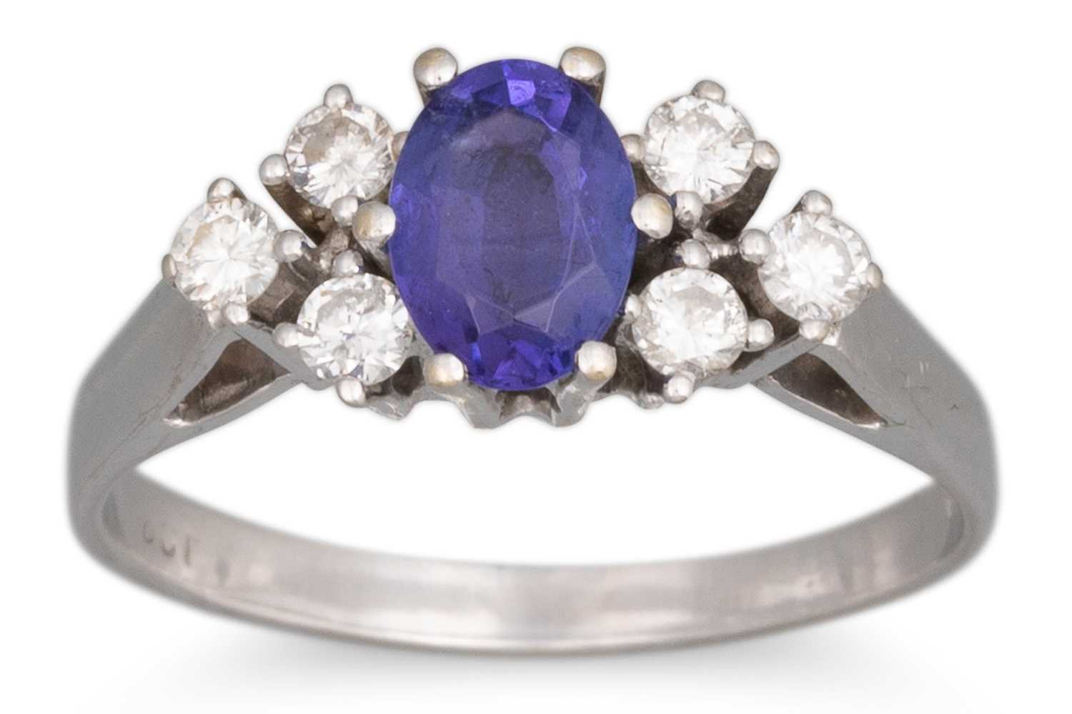 Lot 74 - A TANZANITE AND DIAMOND RING, the oval...