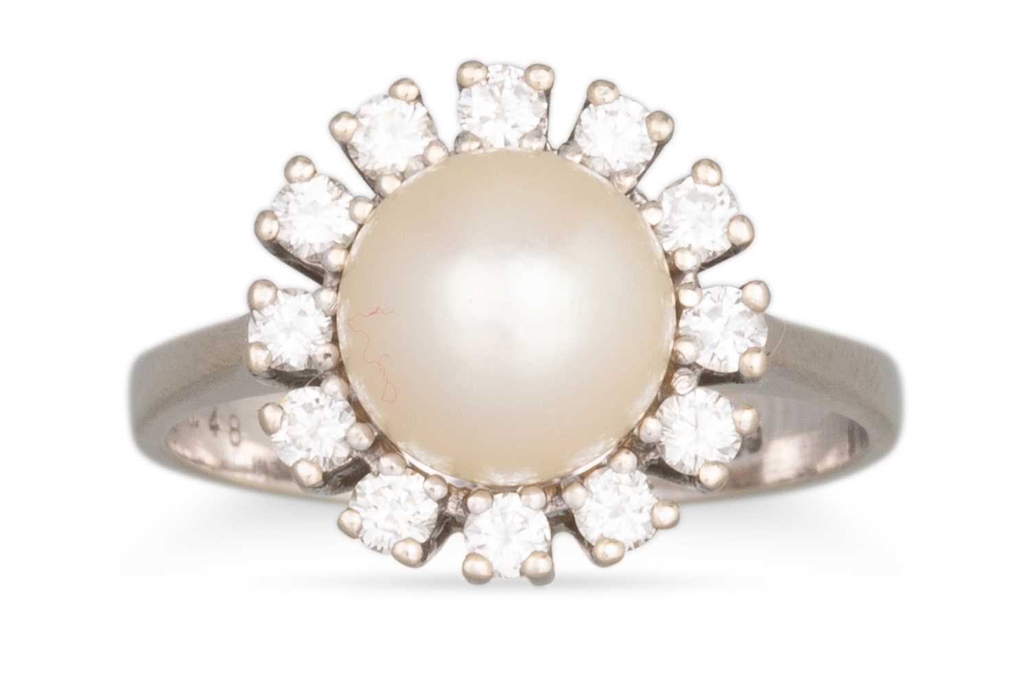 Lot 76 - A PEARL AND DIAMOND CLUSTER RING, the central...