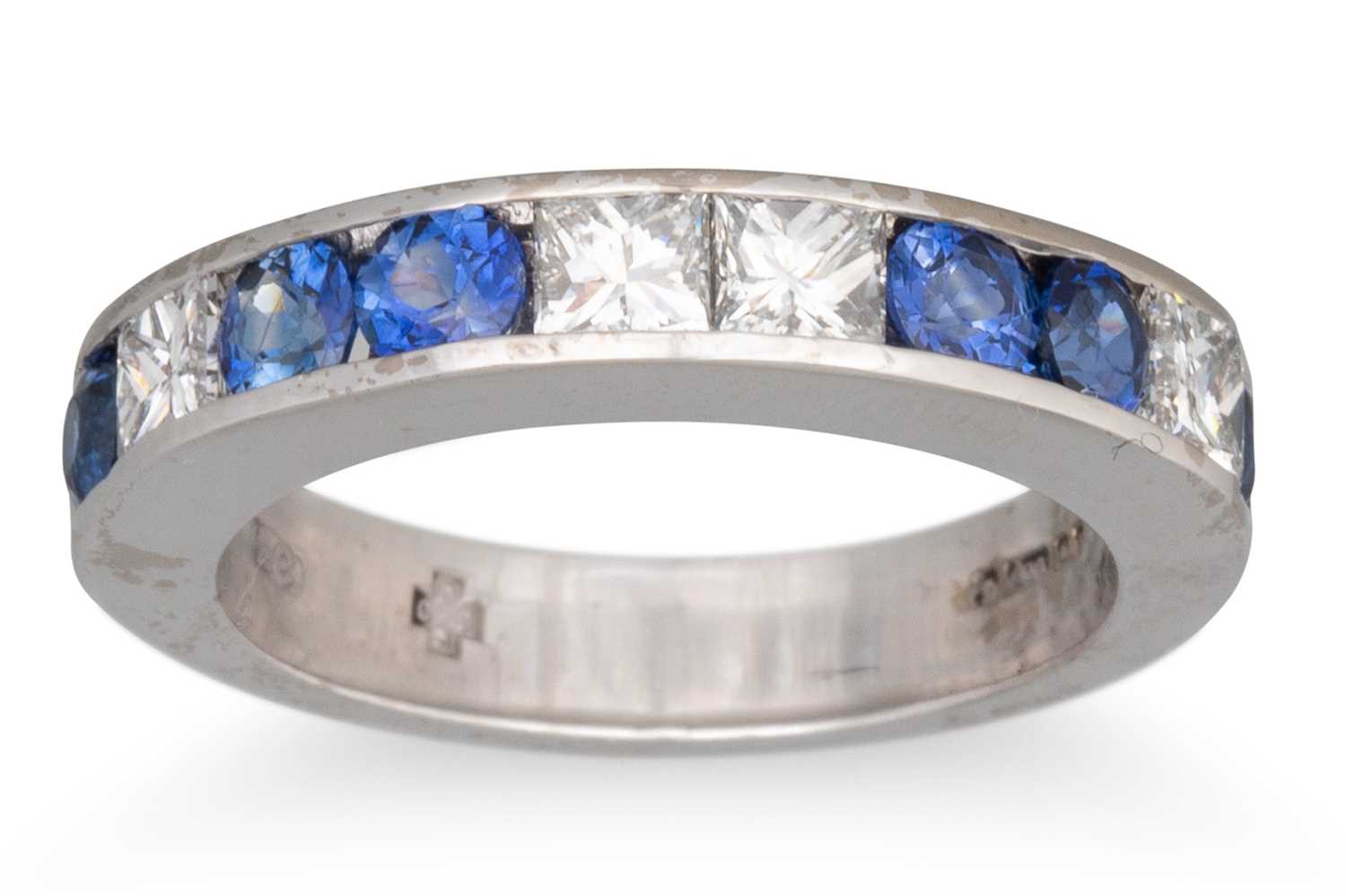 Lot 61 - A DIAMOND AND SAPPHIRE HALF ETERNITY RING, set...
