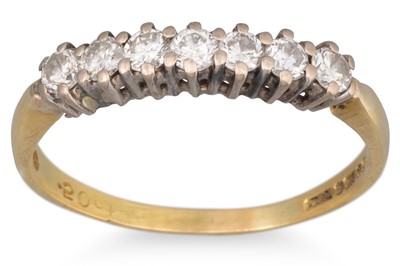 Lot 10 - A DIAMOND SEVEN STONE RING, the round...