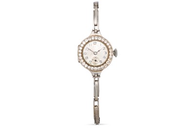 Lot 398 - A VINTAGE LADY'S DIAMOND SET WRISTWATCH,...