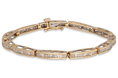 Lot 83 - A DIAMOND BRACELET, channel set with brilliant...