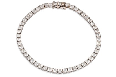 Lot 346 - A DIAMOND LINE BRACELET, the round brilliant...