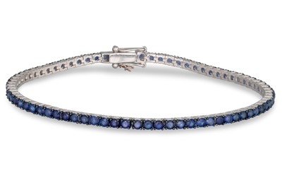 Lot 224 - A SAPPHIRE LINE BRACELET, mounted in 18ct...