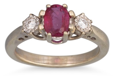 Lot 225 - A RUBY AND DIAMOND RING, the oval ruby to...