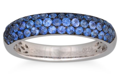 Lot 258 - A SAPPHIRE PAVÉ SET BAND, mounted in 18ct...