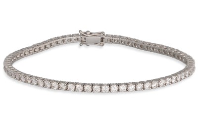 Lot 266 - A DIAMOND LINE BRACELET, the brilliant cut...