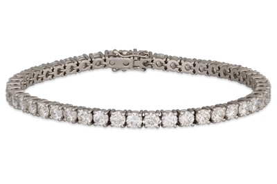 Lot 267 - A DIAMOND LINE BRACELET, the brilliant cut...