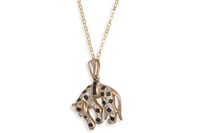 Lot 129 - A 9CT GOLD PENDANT, modelled as a panther on a...