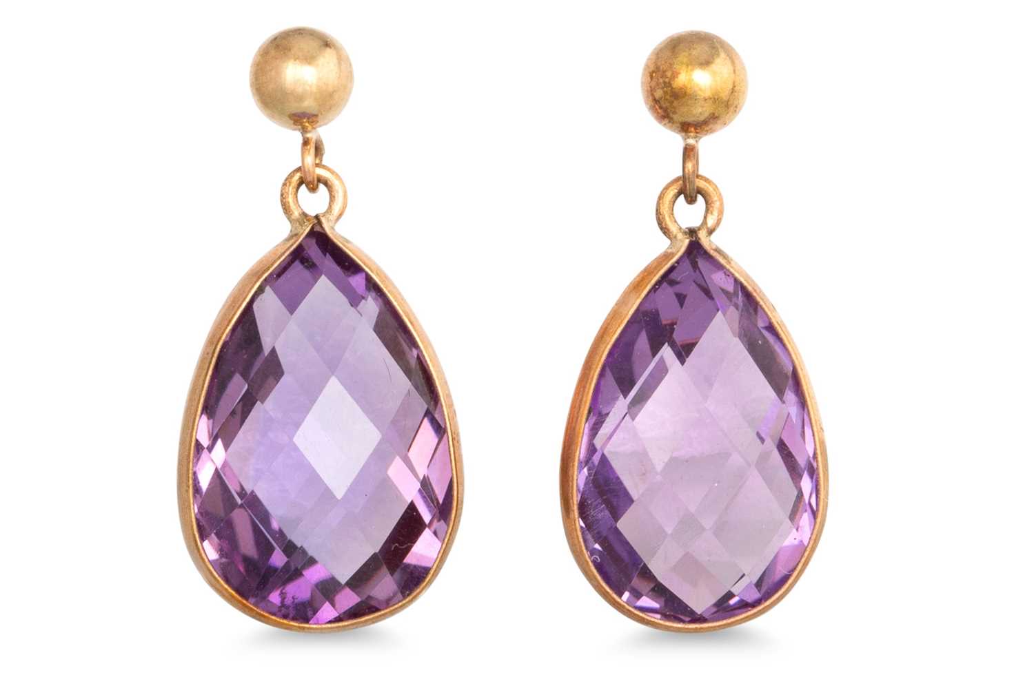 Lot 18 - A PAIR OF AMETHYST DROP EARRINGS, the pear cut...