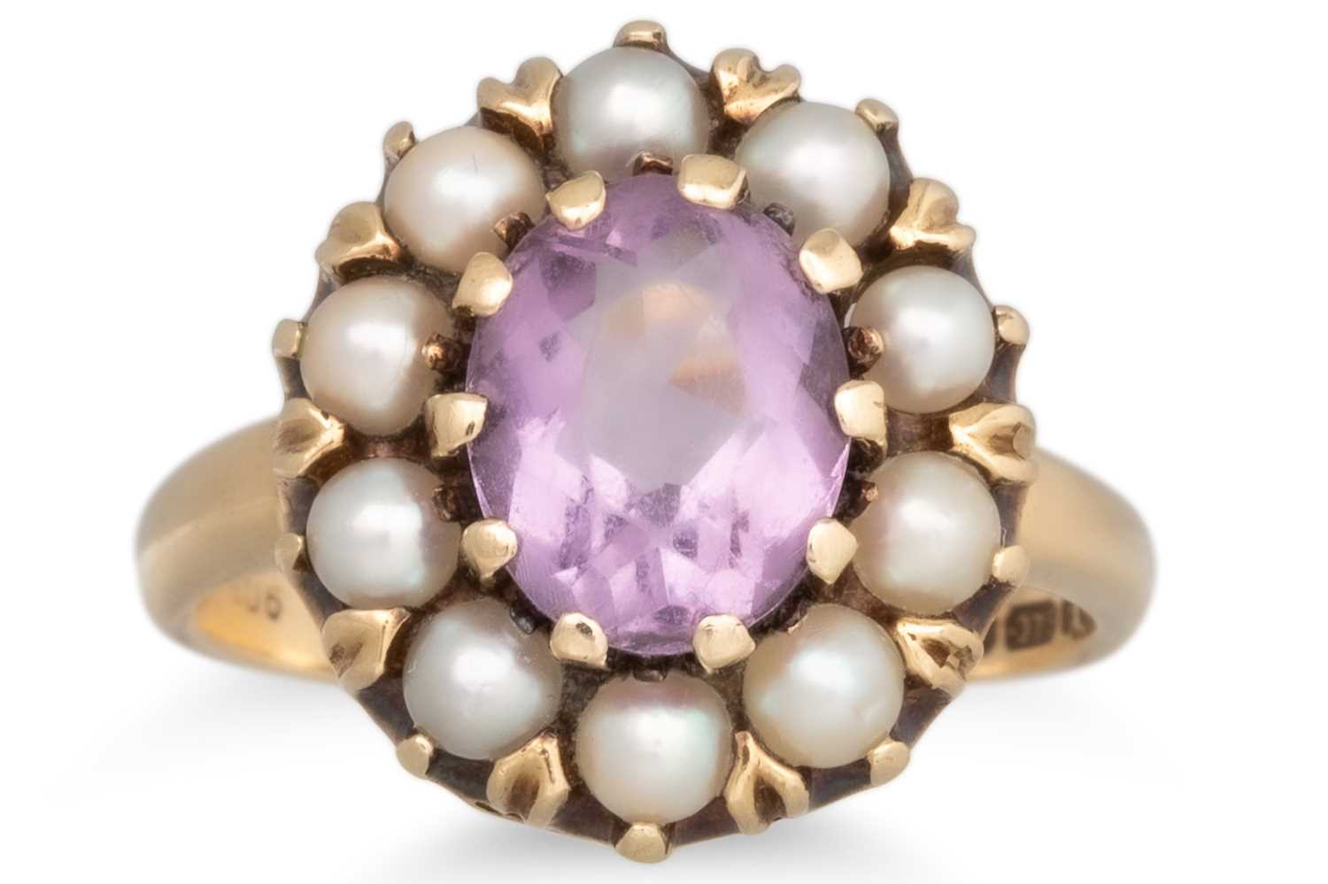 Lot 32 - AN AMETHYST AND PEARL CLUSTER RING, the oval...