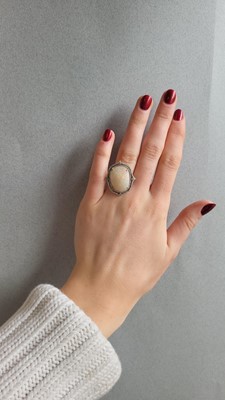 Lot 94 - AN OPAL AND DIAMOND CLUSTER RING, mounted in...