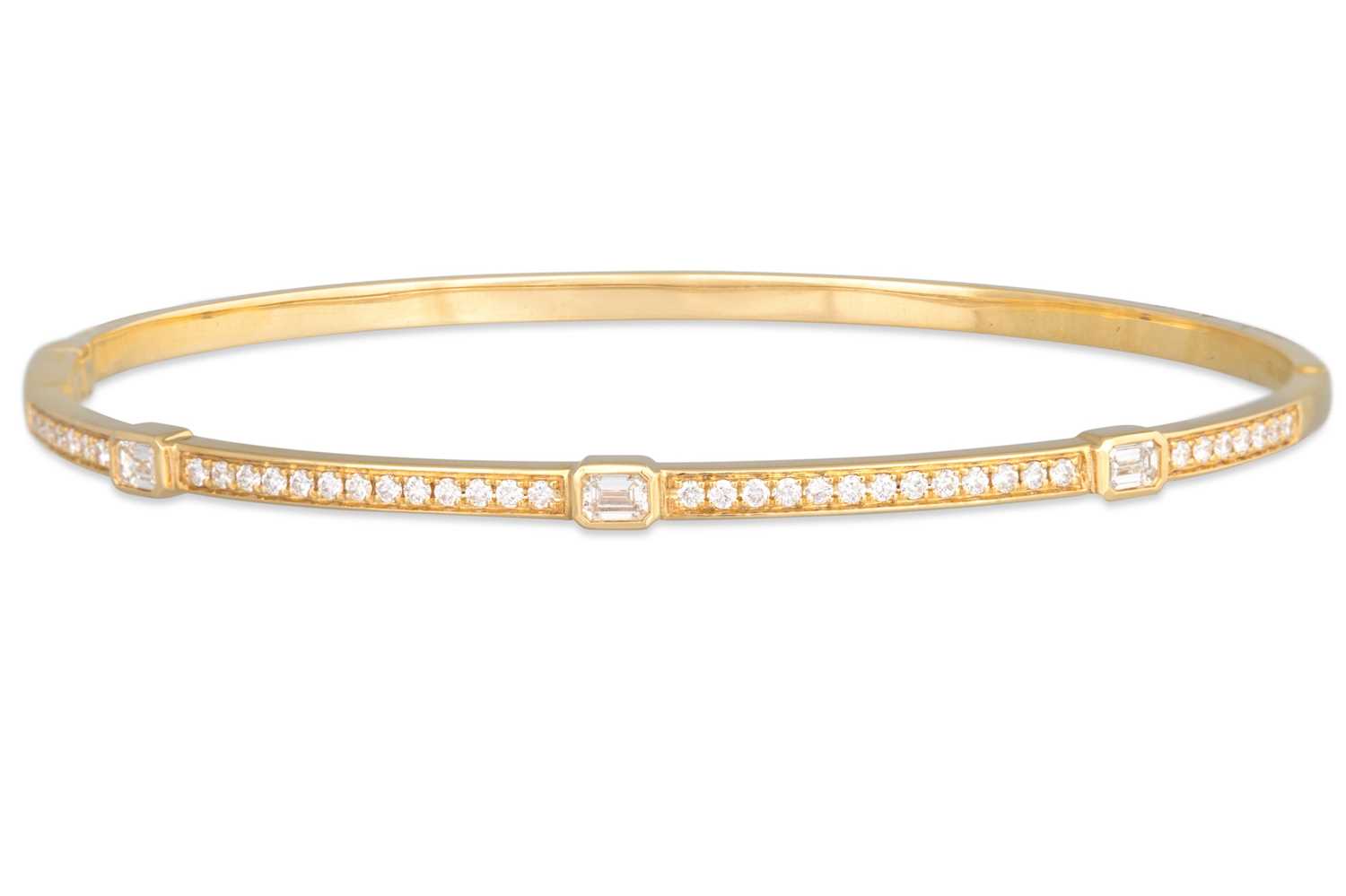 Lot 230 - A DIAMOND SET BANGLE, set with emerald cut