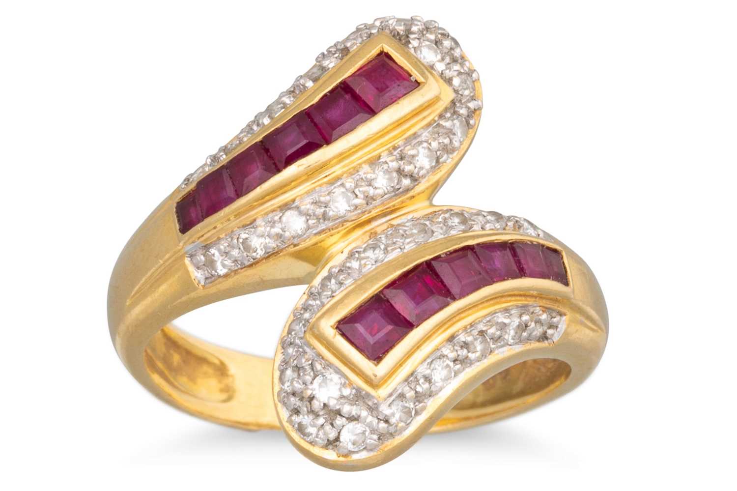 Lot 154 - A RUBY AND DIAMOND CROSS OVER RING, mounted in...