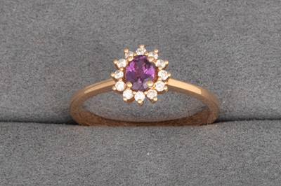 Lot 87 - A PINK SAPPHIRE AND DIAMOND CLUSTER RING, the...