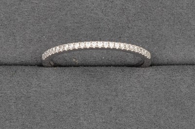 Lot 102 - A DIAMOND HALF ETERNITY RING, mounted in...