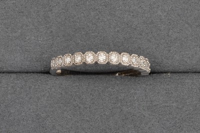 Lot 34 - A DIAMOND SET ETERNITY RING, in 9ct white gold....