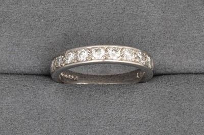 Lot 46 - A DIAMOND HALF ETERNITY RING, in platinum....