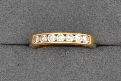 Lot 48 - A DIAMOND HALF ETERNITY RING, the brilliant...