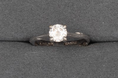 Lot 53 - A CHUPI RING, set with a white stone, mounted...