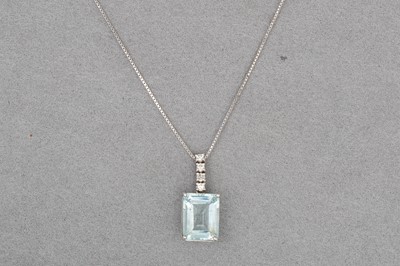 Lot 157 - AN AQUAMARINE AND DIAMOND PENDANT, mounted in...