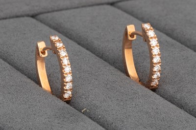 Lot 162 - A PAIR OF DIAMOND 'HUGGIE' HOOP EARRINGS,...