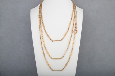 Lot 137 - A VINTAGE GOLD LINKED MUFF CHAIN, unusual form,...