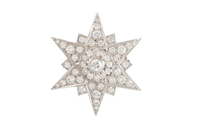 Lot 424 - A DIAMOND SET STAR BROOCH, the brilliant cut...