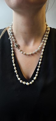 Lot 47 - A STRING OF GREY RIVER PEARLS, to a 14ct gold...
