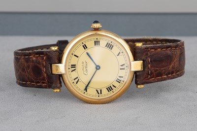 Lot 187 - A GOLD PLATED ON SILVER MUST DE CARTIER LADY'S...